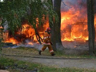 A firefighter at the scene of a fire